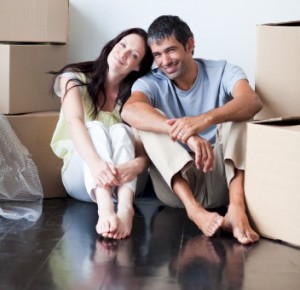 couple sitting on stained floor